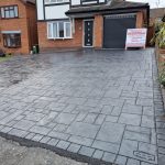 Sloping poured concrete driveway